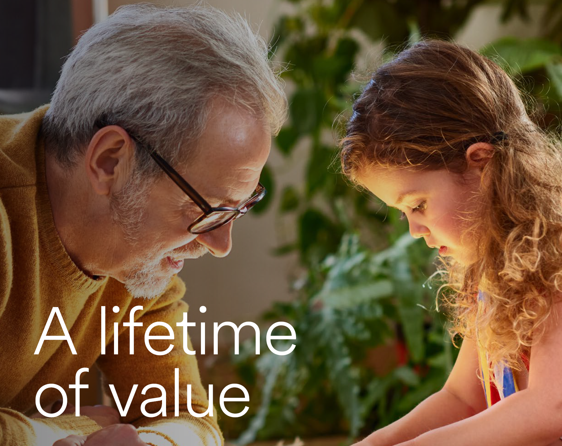 Person at standing desk working on laptop